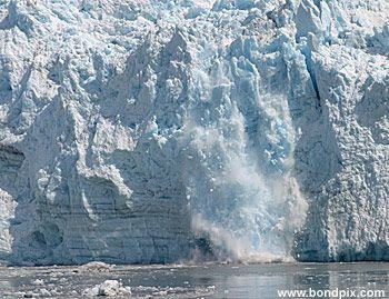 Calving ice falls from the Hubbard Glacier in Yakutat bay, Alaska