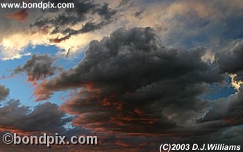 Sun setting on storm clouds in Montana
