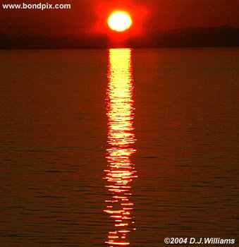 alaska sun rises from the sea