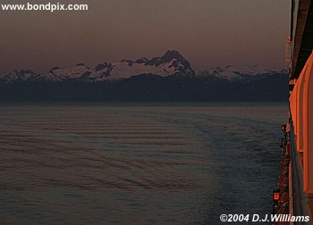 sunrise over snow capped alaska mountains